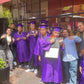 Group of Learning Works graduates in their purple caps and gowns.